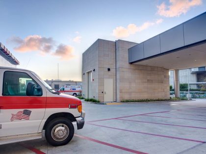 Exterior view of building with ambulance